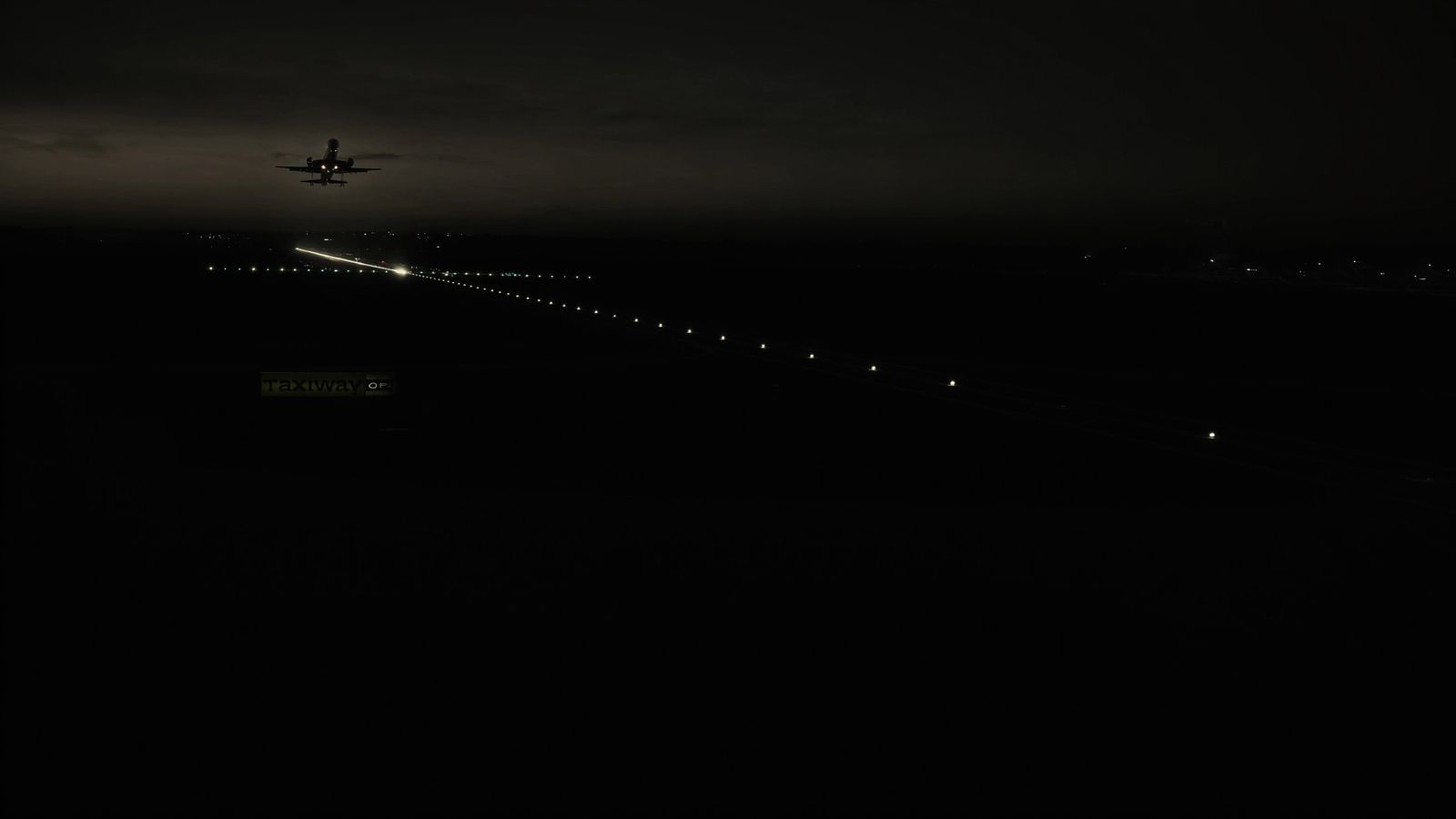 A wide-body airliner on final approach at dusk over a dark airfield, a single chartreuse runway centreline light chain leading into the distance