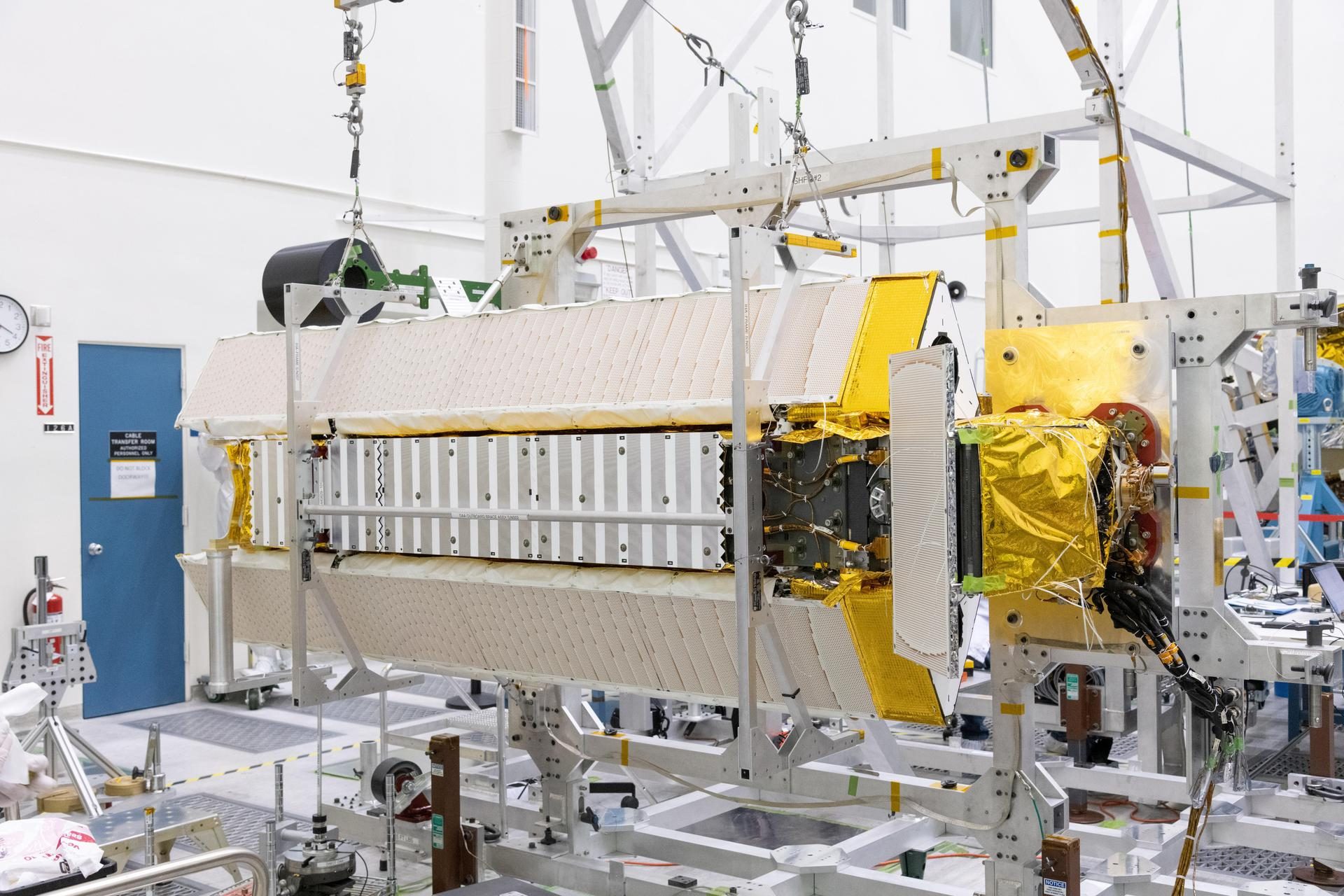 NASA SWOT satellite suspended in a clean room before launch