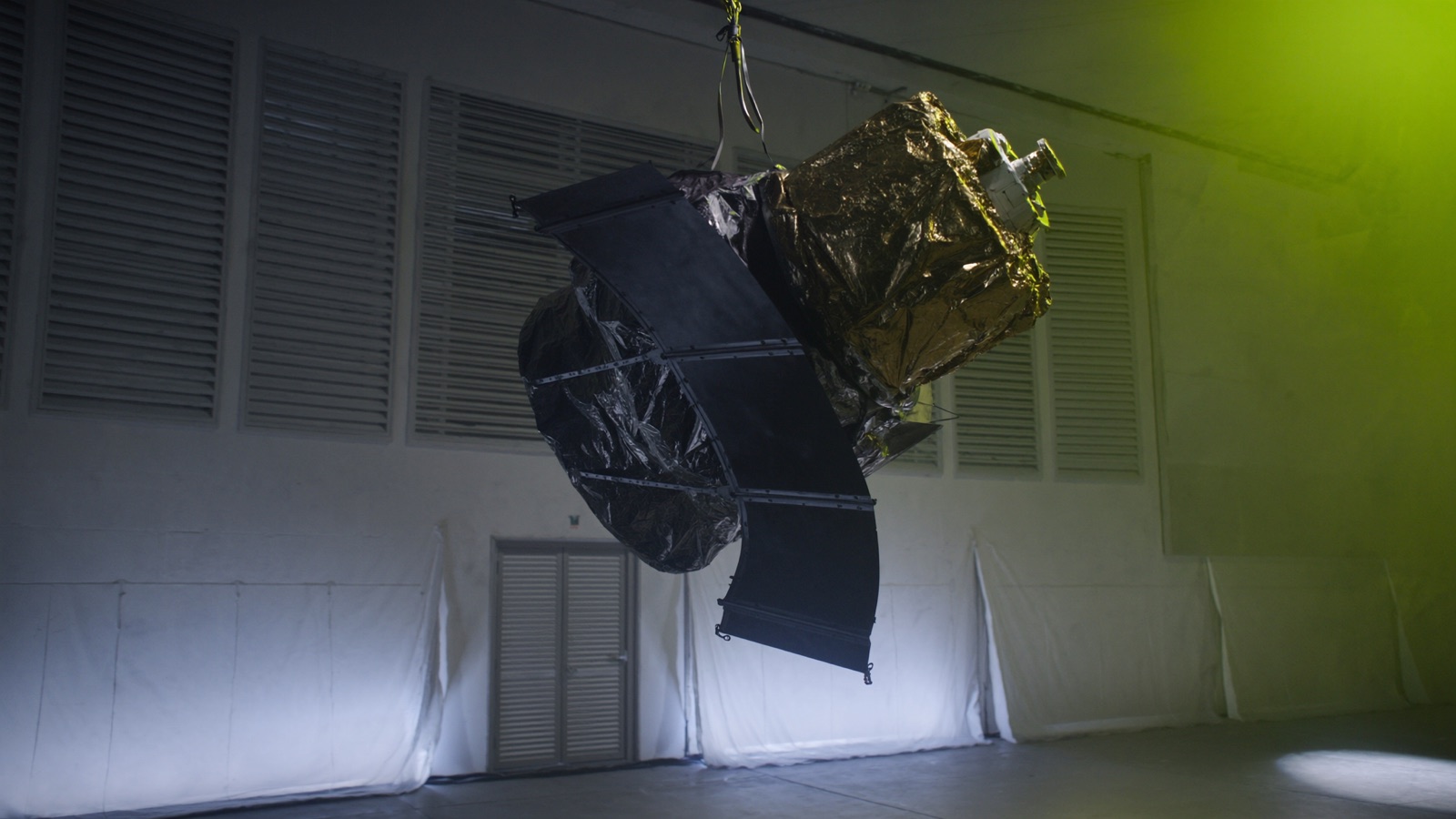 Satellite suspended in a clean room before launch